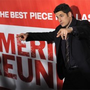 Jason Biggs at the American Reunion premiere in front of TRIO printed graphics