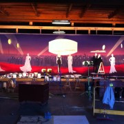TRIO creating a hand-painted backdrop for a theatre in China