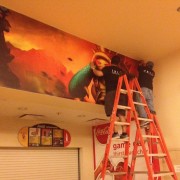 TRIO installing League of Legends graphics at the World Championship Competition