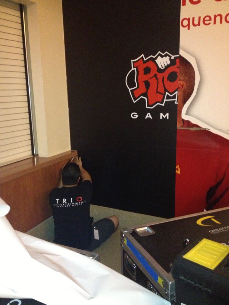 TRIO installing Riot games graphics at the USC Galen Center