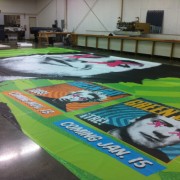 TRIO grande-format printed Green Day Scrim being finished in print shop