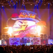 Poison on stage with TRIO hand-painted backdrop