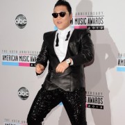 Psy in front of TRIO printed step and repeat - 40th Annual AMAs