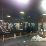 TRIO hand-painting the Ronnie Dunn backdrop